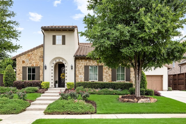 655 Creekway Dr, Irving, TX 75039 - mediterranean / spanish home featuring a tiled roof, stone siding, a garage, and driveway