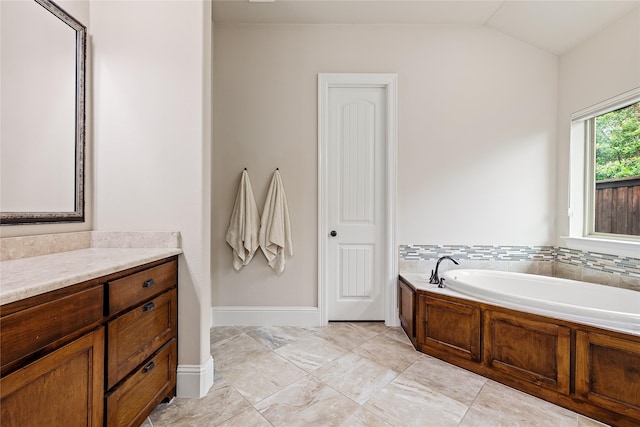 655 Creekway Dr, Irving, TX 75039 - full bath with a bath, lofted ceiling, baseboards, and vanity