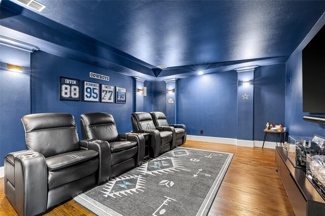 655 Creekway Dr, Irving, TX 75039 - home theater room featuring wood finished floors and baseboards