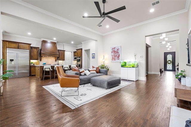 655 Creekway Dr, Irving, TX 75039 - living area featuring a ceiling fan, dark wood-type flooring, recessed lighting, baseboards, and ornamental molding