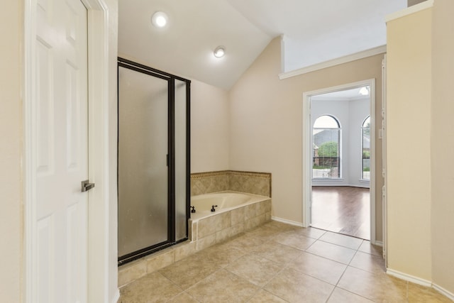 4103 Bendwood Ln, Dallas, TX 75287 - bathroom with a shower stall, a bath, vaulted ceiling, tile patterned flooring, and baseboards