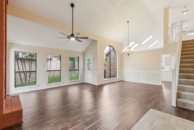 4103 Bendwood Ln, Dallas, TX 75287 - unfurnished living room featuring stairs, a chandelier, wainscoting, dark wood-style floors, and a ceiling fan