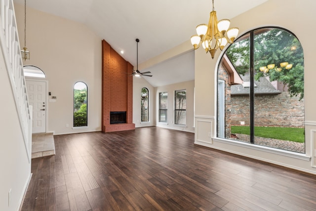 4103 Bendwood Ln, Dallas, TX 75287 - unfurnished living room featuring a brick fireplace, a chandelier, dark wood-style floors, a ceiling fan, and high vaulted ceiling