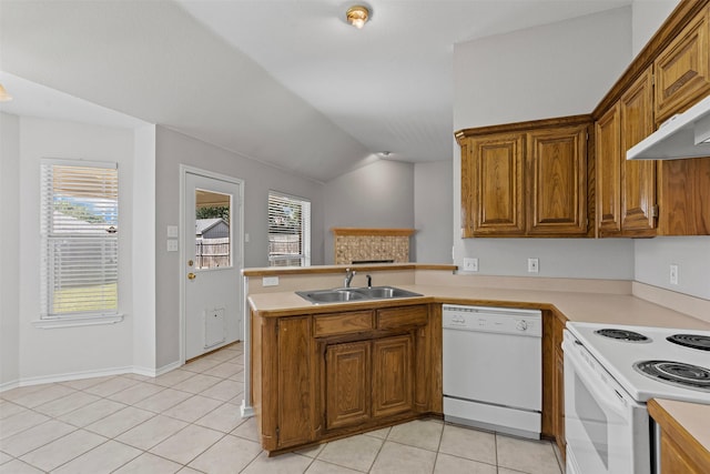 1039 Spring Hill Dr, Saginaw, TX 76179 - kitchen featuring white appliances, brown cabinetry, light countertops, and vaulted ceiling