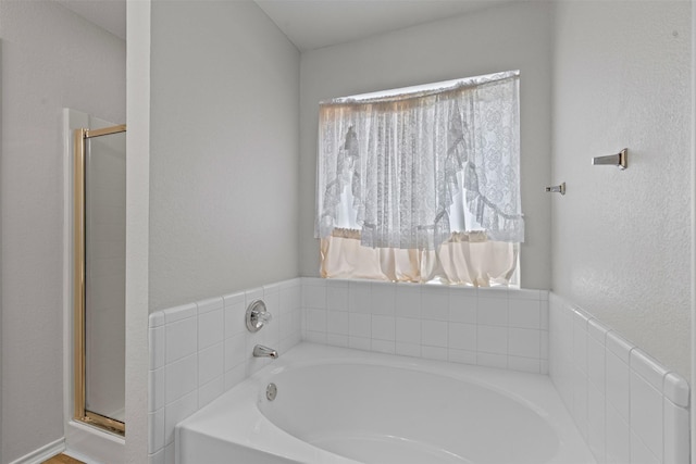 1039 Spring Hill Dr, Saginaw, TX 76179 - bathroom featuring a bath and a shower stall