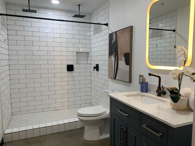 1122 Jackson St Unit 416, Dallas, TX 75202 - full bath featuring vanity, tiled shower, and toilet