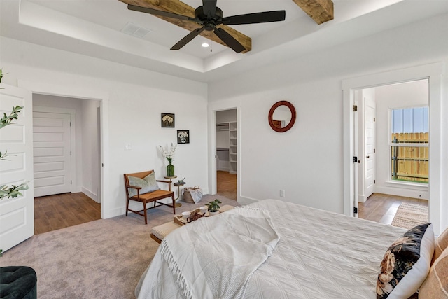 416 Redbud Ln, Tolar, TX 76476 - bedroom featuring recessed lighting, a walk in closet, baseboards, a tray ceiling, and carpet