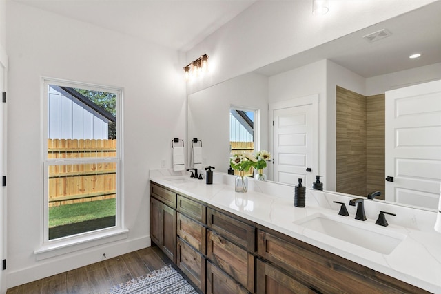 416 Redbud Ln, Tolar, TX 76476 - full bath featuring double vanity, wood finished floors, baseboards, and recessed lighting