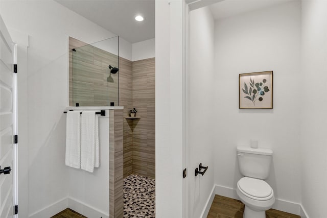 416 Redbud Ln, Tolar, TX 76476 - full bathroom with baseboards, a tile shower, toilet, recessed lighting, and wood finished floors