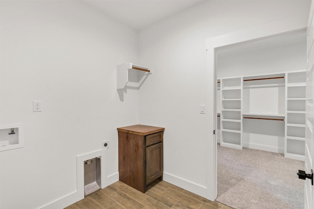 416 Redbud Ln, Tolar, TX 76476 - washroom featuring electric dryer hookup, baseboards, wood finished floors, and hookup for a washing machine