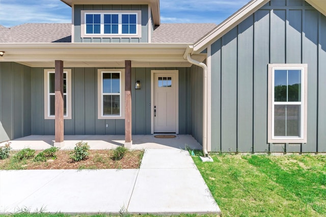 416 Redbud Ln, Tolar, TX 76476 - doorway to property featuring board and batten siding, a shingled roof, a porch, and a yard