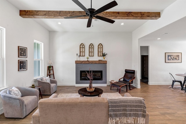 416 Redbud Ln, Tolar, TX 76476 - living room featuring recessed lighting, beam ceiling, wood finished floors, a fireplace, and ceiling fan