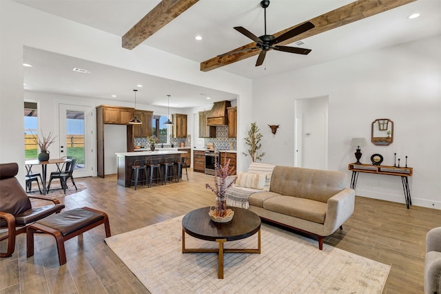 416 Redbud Ln, Tolar, TX 76476 - living room featuring recessed lighting, light wood finished floors, beamed ceiling, ceiling fan, and baseboards