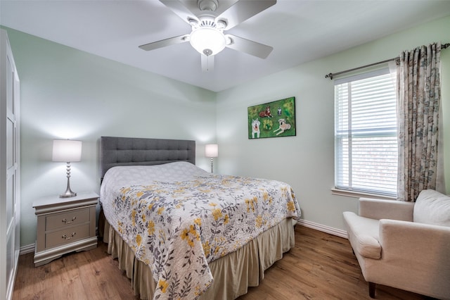9912 Fillmore Dr, Mckinney, TX 75072 - bedroom with baseboards, wood finished floors, multiple windows, and ceiling fan