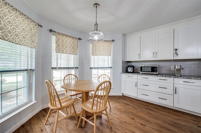 9912 Fillmore Dr, Mckinney, TX 75072 - dining space with wood finished floors and baseboards