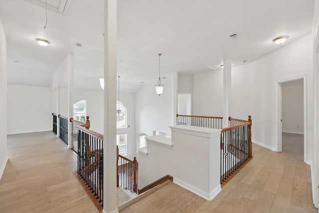 2410 Honey Dr, Arlington, TX 76001 - hallway featuring an upstairs landing, attic access, and light wood-style flooring