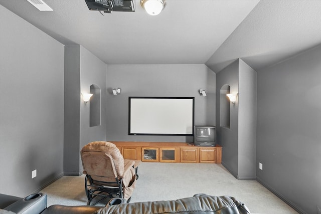 2410 Honey Dr, Arlington, TX 76001 - home theater room with arched walkways and light colored carpet