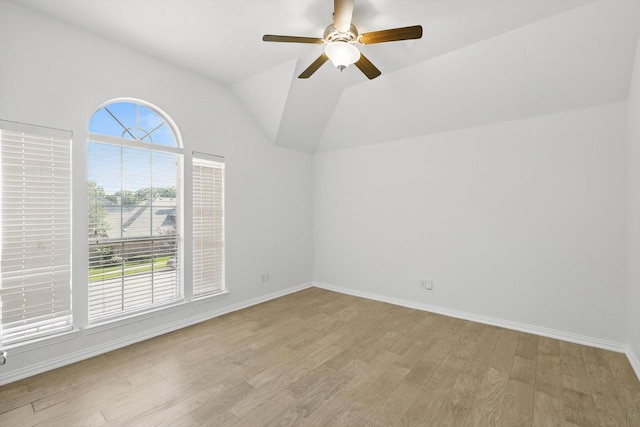 2410 Honey Dr, Arlington, TX 76001 - spare room featuring light wood-style floors, a ceiling fan, and lofted ceiling