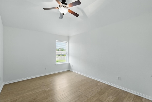 2410 Honey Dr, Arlington, TX 76001 - spare room with light wood-type flooring, ceiling fan, and lofted ceiling