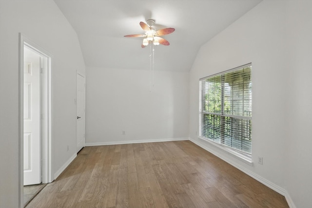 2410 Honey Dr, Arlington, TX 76001 - spare room featuring lofted ceiling, light wood-type flooring, and ceiling fan