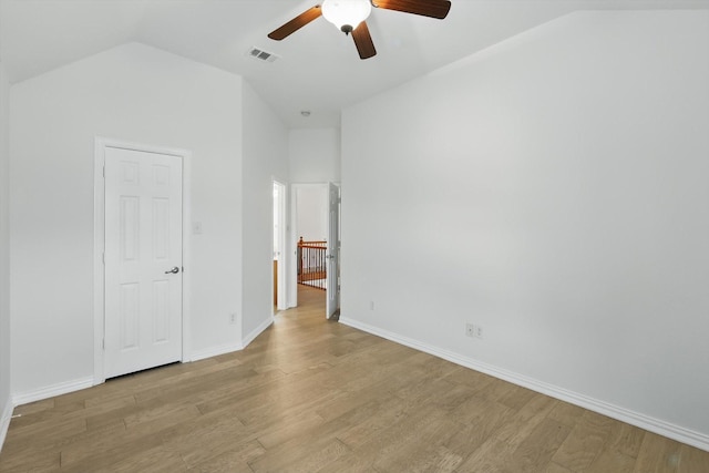 2410 Honey Dr, Arlington, TX 76001 - unfurnished bedroom featuring lofted ceiling, light wood-style flooring, and a ceiling fan