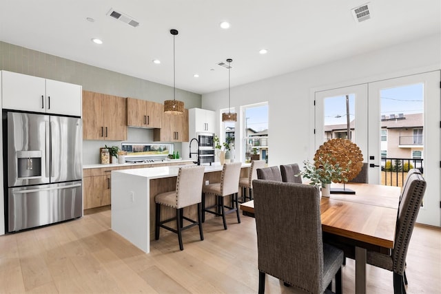 815 E 5th St, Dallas, TX 75203 - dining room with light wood-style floors, recessed lighting, and french doors