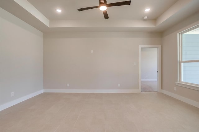 2602 23rd St, Fort Worth, TX 76106 - empty room featuring a raised ceiling, ceiling fan, recessed lighting, and healthy amount of natural light