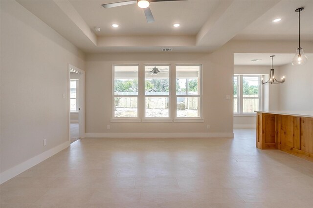 2602 23rd St, Fort Worth, TX 76106 - empty room with ceiling fan, baseboards, a chandelier, a raised ceiling, and recessed lighting