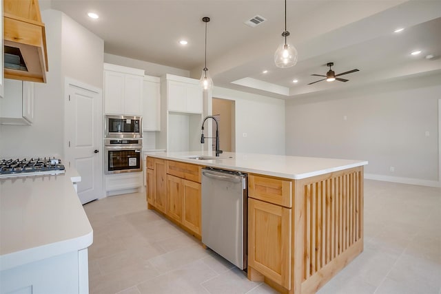 2602 23rd St, Fort Worth, TX 76106 - kitchen featuring appliances with stainless steel finishes, a sink, a raised ceiling, a ceiling fan, and light countertops
