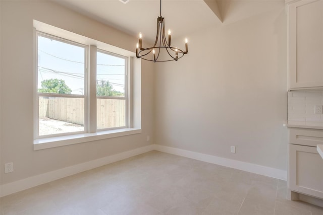 2602 23rd St, Fort Worth, TX 76106 - unfurnished dining area with plenty of natural light, a chandelier, and baseboards