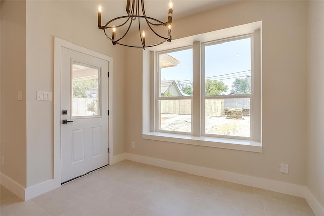 2602 23rd St, Fort Worth, TX 76106 - entryway with a chandelier and baseboards