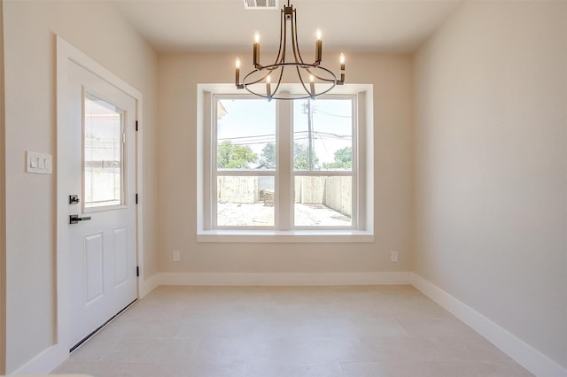 2602 23rd St, Fort Worth, TX 76106 - unfurnished dining area with a chandelier and baseboards