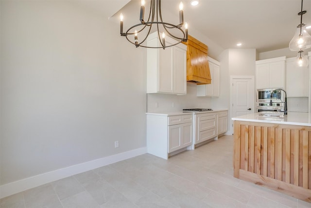 2602 23rd St, Fort Worth, TX 76106 - kitchen featuring backsplash, a chandelier, light countertops, custom exhaust hood, and baseboards