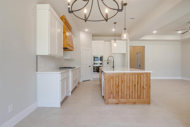 2602 23rd St, Fort Worth, TX 76106 - kitchen with stainless steel appliances, baseboards, a chandelier, white cabinets, and recessed lighting