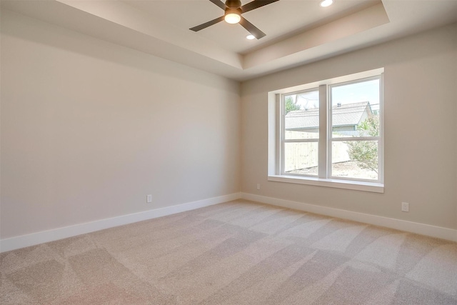 2602 23rd St, Fort Worth, TX 76106 - empty room featuring baseboards, ceiling fan, recessed lighting, a raised ceiling, and light colored carpet