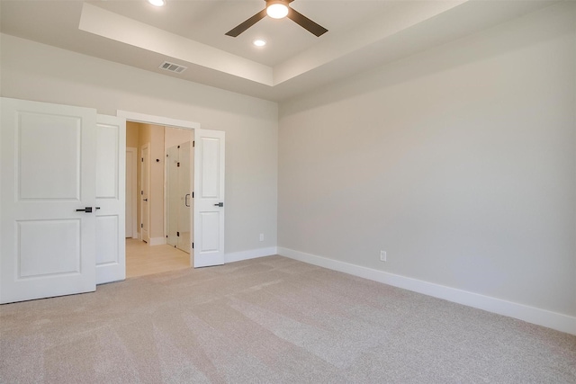 2602 23rd St, Fort Worth, TX 76106 - unfurnished bedroom with light carpet, a tray ceiling, baseboards, recessed lighting, and a ceiling fan