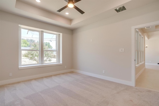 2602 23rd St, Fort Worth, TX 76106 - spare room featuring light carpet, ceiling fan, a raised ceiling, recessed lighting, and baseboards