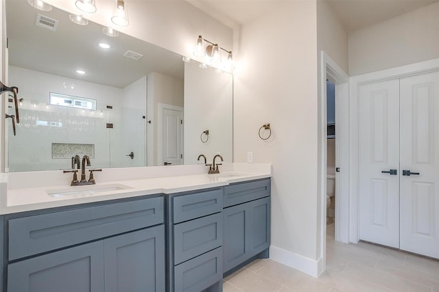 2602 23rd St, Fort Worth, TX 76106 - full bath with tiled shower, double vanity, tile patterned flooring, toilet, and baseboards