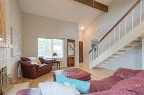 14151 Montfort Dr Unit 201, Dallas, TX 75254 - living room with stairway, wood finished floors, and beam ceiling