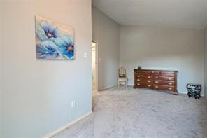 14151 Montfort Dr Unit 201, Dallas, TX 75254 - bedroom featuring baseboards and carpet flooring