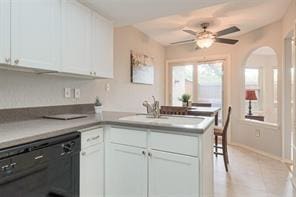 14151 Montfort Dr Unit 201, Dallas, TX 75254 - kitchen featuring dishwasher, a peninsula, a sink, and white cabinets