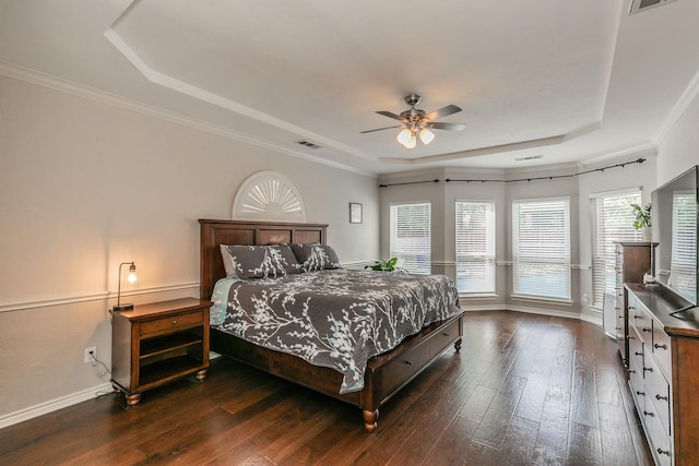 5424 Yellow Birch Dr, Fort Worth, TX 76244 - bedroom featuring a raised ceiling, dark wood-style floors, baseboards, a ceiling fan, and crown molding