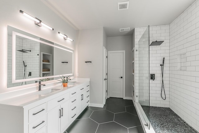 5424 Yellow Birch Dr, Fort Worth, TX 76244 - bathroom with double vanity, a walk in shower, tile patterned flooring, and a closet