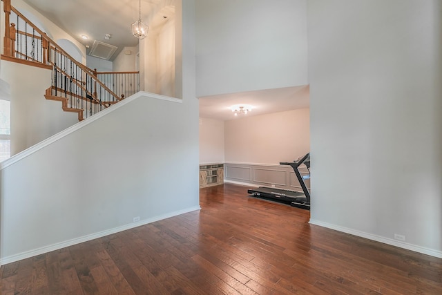 5424 Yellow Birch Dr, Fort Worth, TX 76244 - staircase featuring a towering ceiling, wood-type flooring, and baseboards