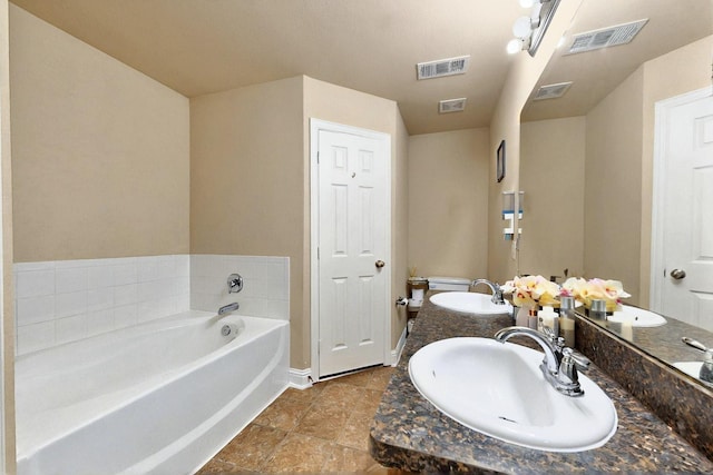 2715 Myopia Ct, Dallas, TX 75253 - bathroom with a bath, baseboards, double vanity, and tile patterned flooring