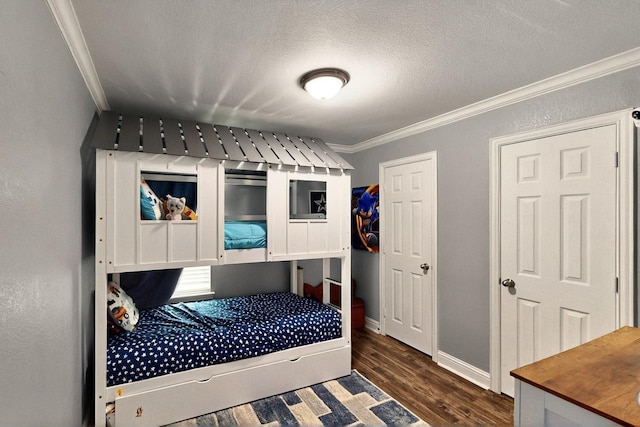 2715 Myopia Ct, Dallas, TX 75253 - bedroom with crown molding, dark wood-type flooring, baseboards, and a textured ceiling