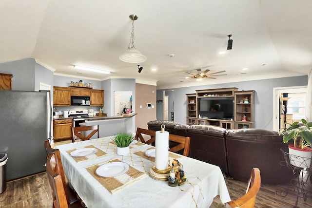 2715 Myopia Ct, Dallas, TX 75253 - dining area with dark wood-style floors, ornamental molding, ceiling fan, and lofted ceiling