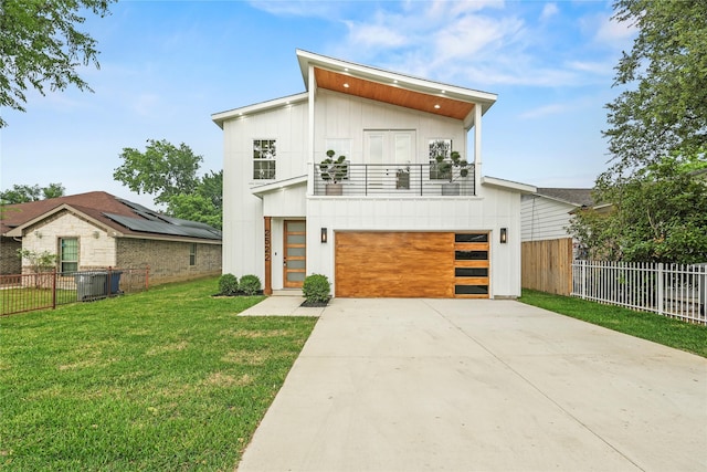 2522 Seevers Ave, Dallas, TX 75216 - contemporary house featuring a balcony, board and batten siding, driveway, and an attached garage