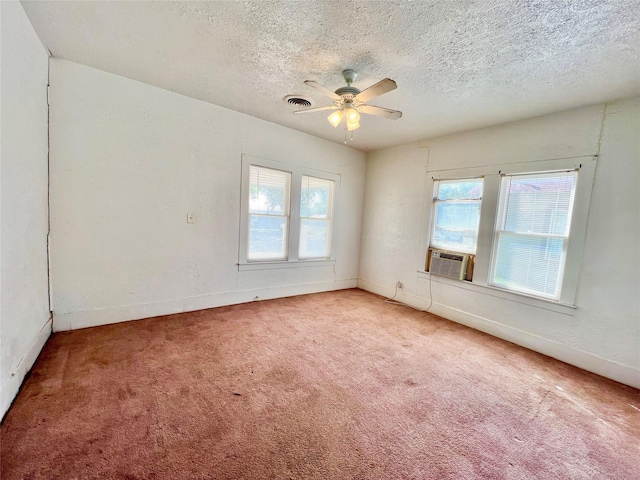 1801 6th St, Brownwood, TX 76801 - unfurnished room featuring a textured ceiling, carpet, a ceiling fan, cooling unit, and baseboards