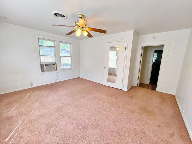 1801 6th St, Brownwood, TX 76801 - spare room featuring carpet floors, cooling unit, baseboards, and ceiling fan